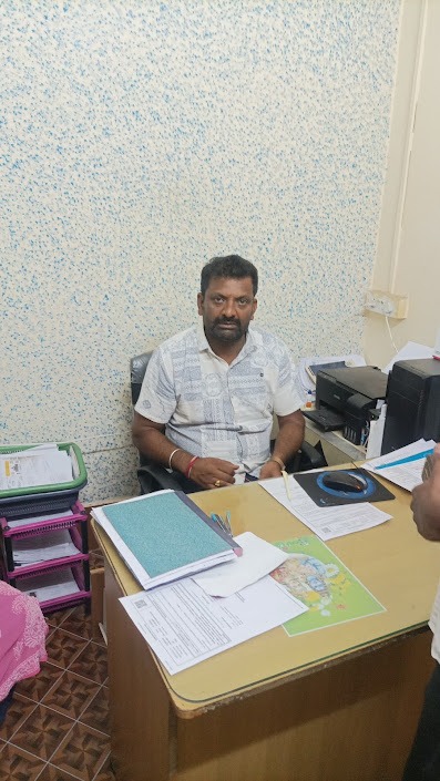 Sri Subramanya office instructor helping a student
